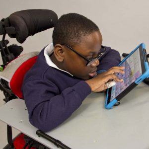 boy using touch screen device